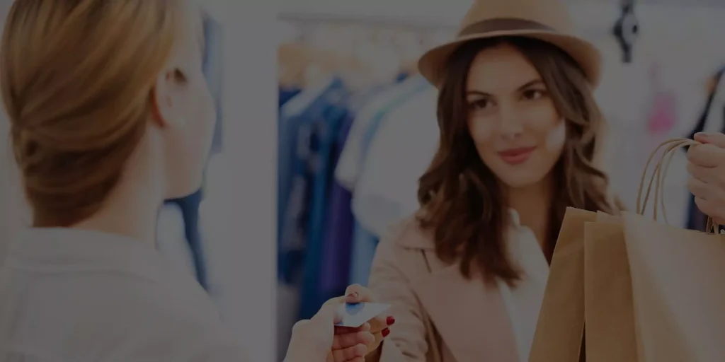 lady at till showing human interation in retail